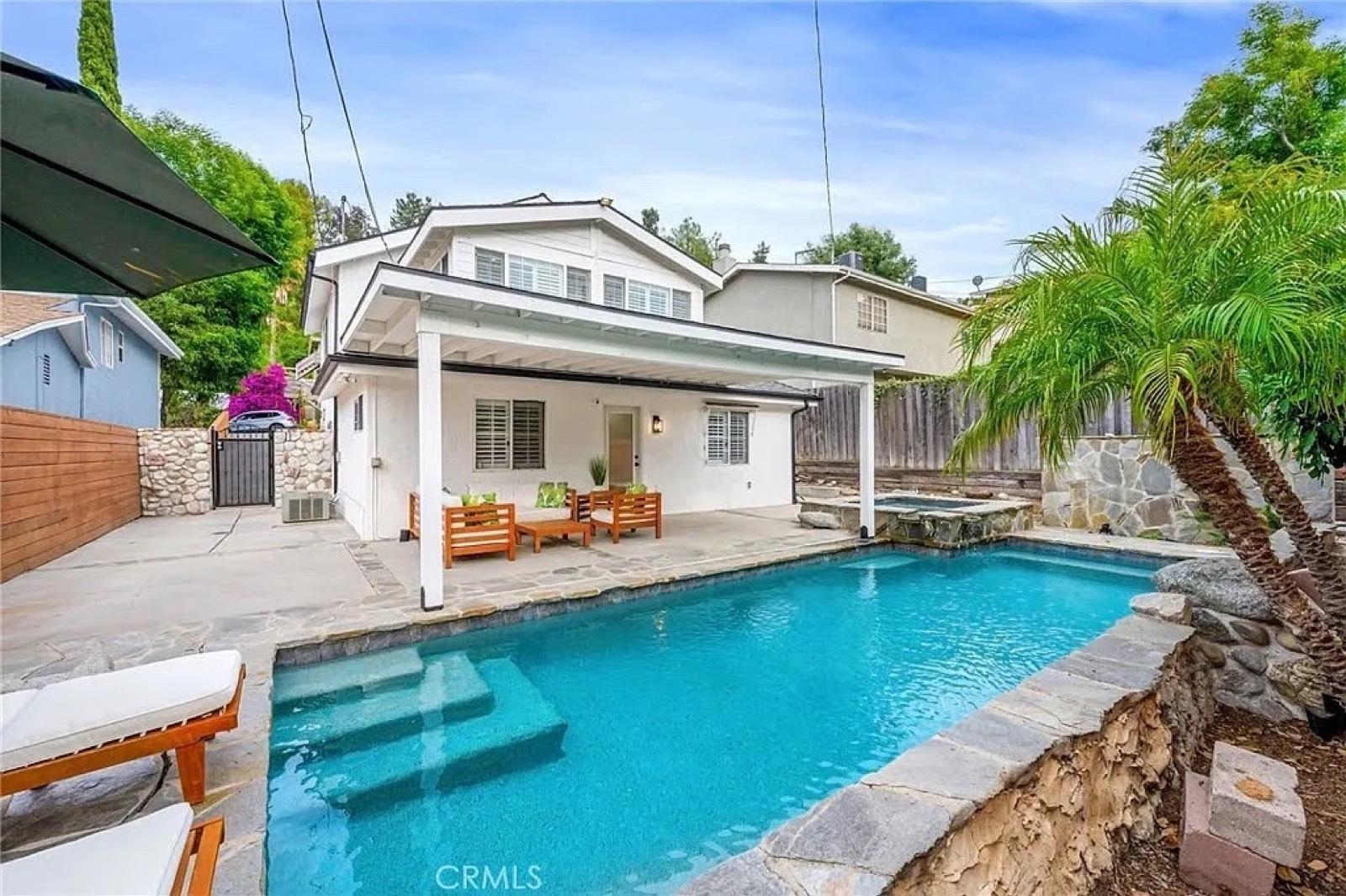 BEAUTIFUL WHITE home W great pool — photo 1